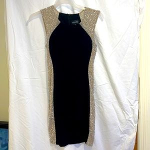 Black side beaded cocktail dress. XSCAPE Worn once,Dry cleaned, size 4 like new